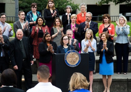 Kate Brown speaks at podium