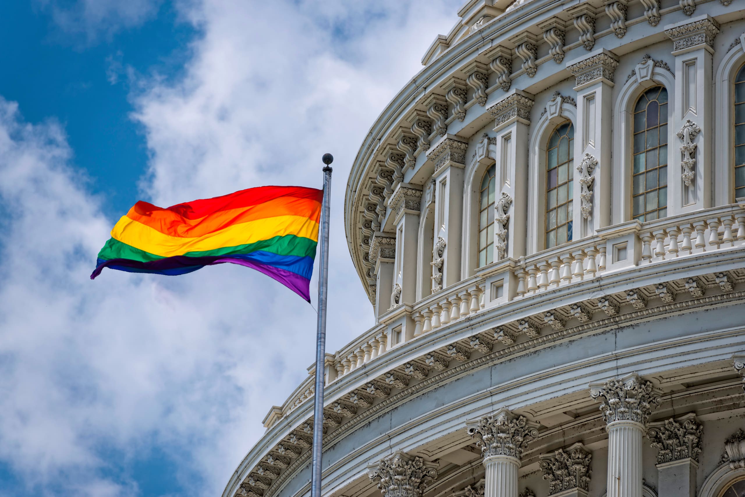 A rainbow flag flies at the US Capitol